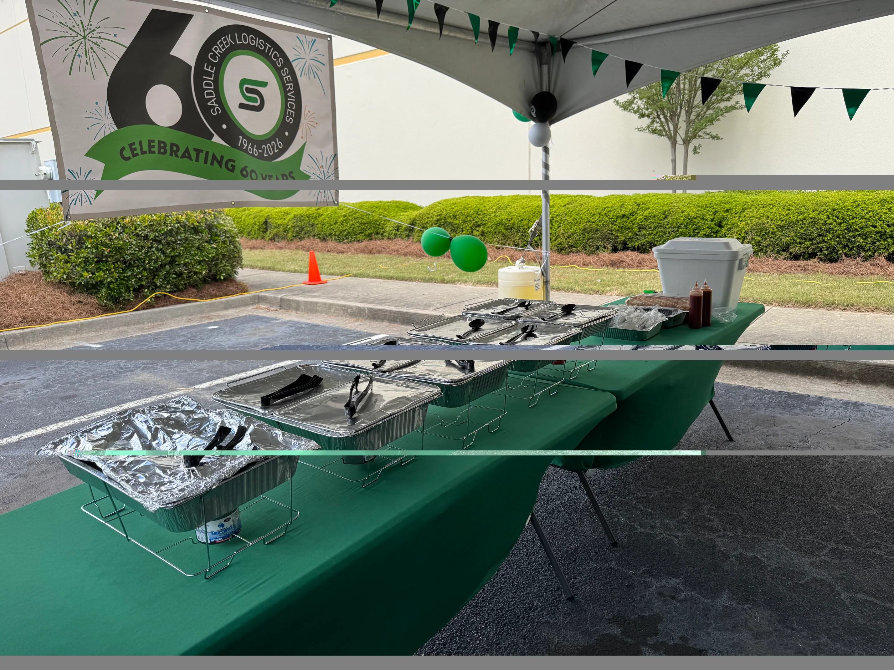 Catering setup for a corporate event with food trays and decorations