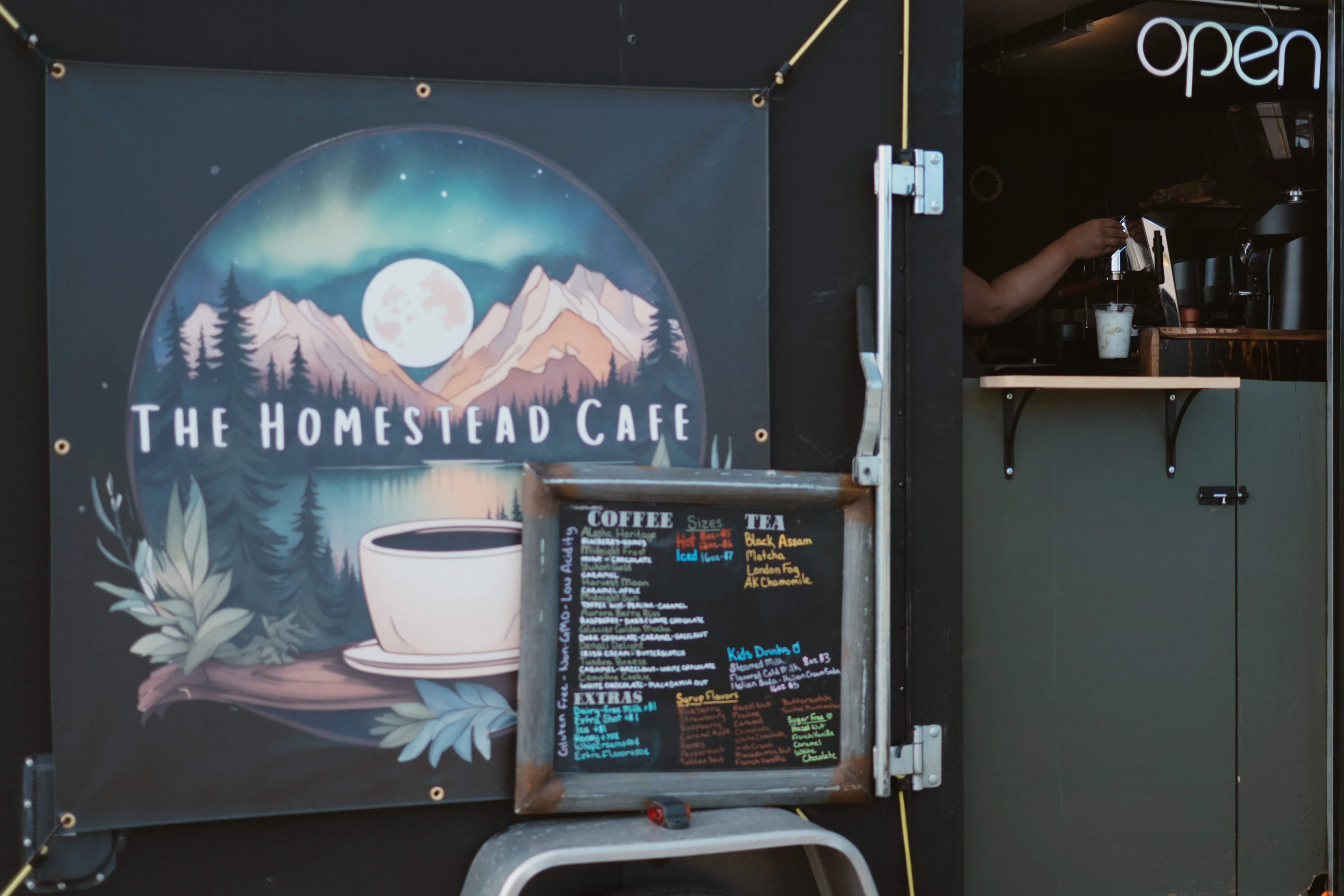 The Homestead Cafe sign with coffee menu and open sign