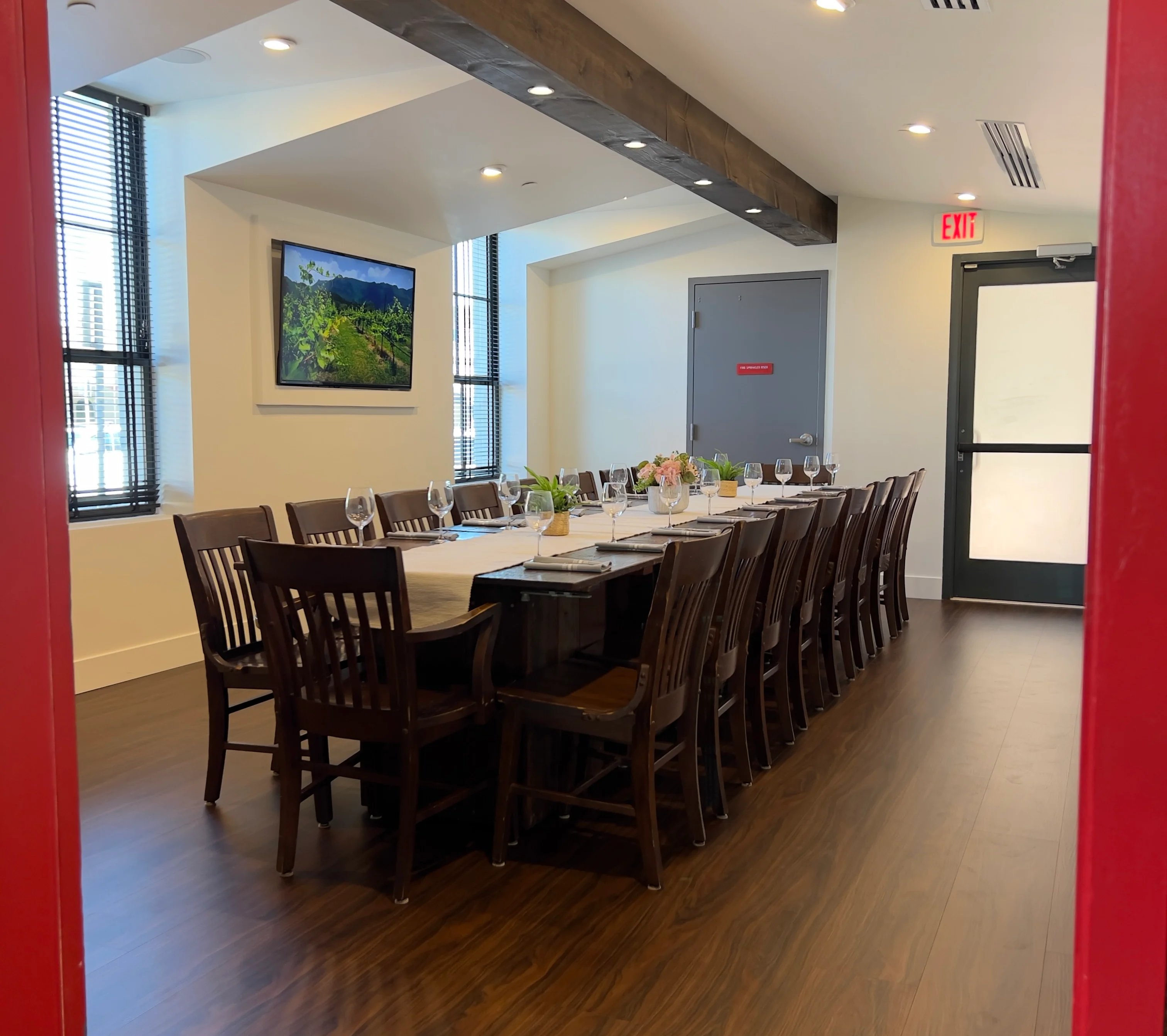 Elegant private dining room with long table and modern decor