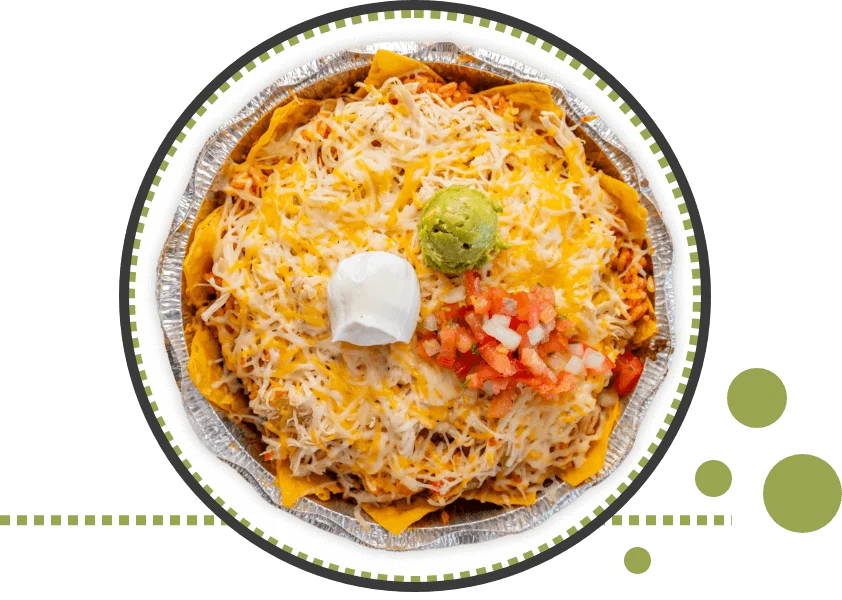 Loaded nachos topped with cheese and guacamole