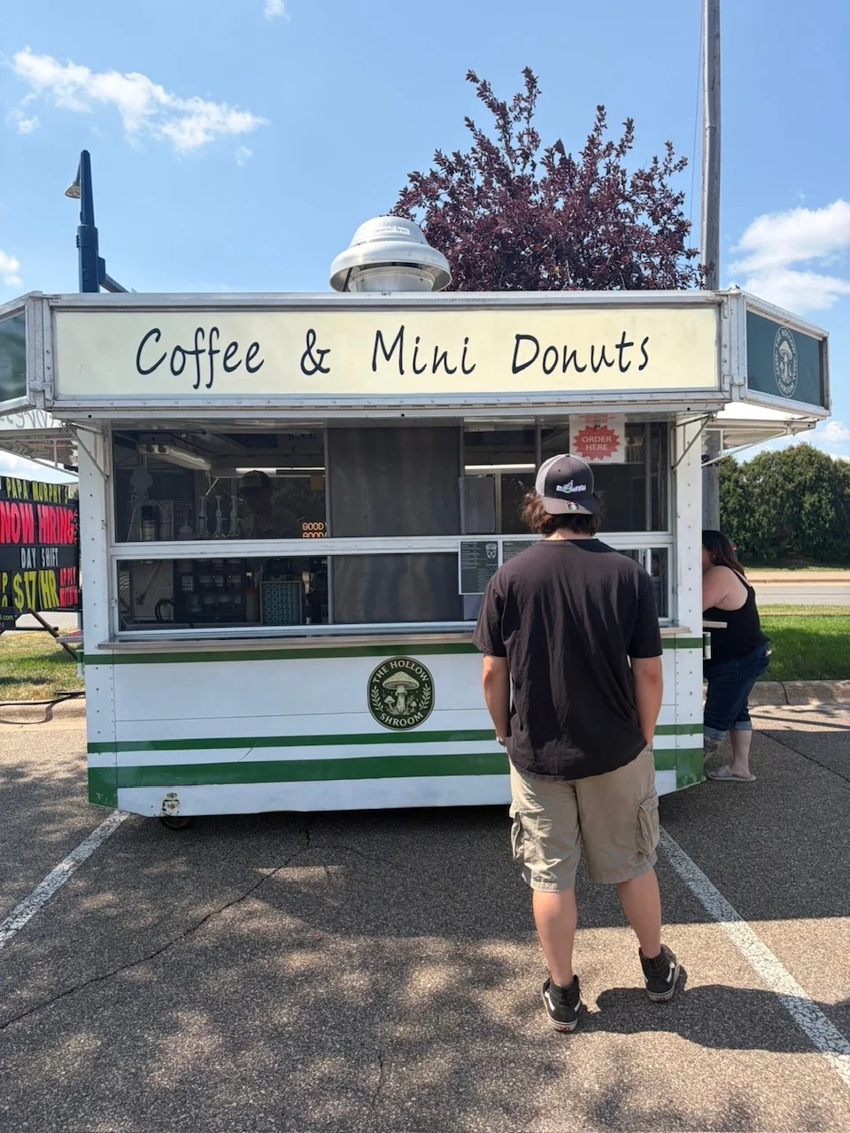 Coffee and mini donuts food truck at an outdoor event