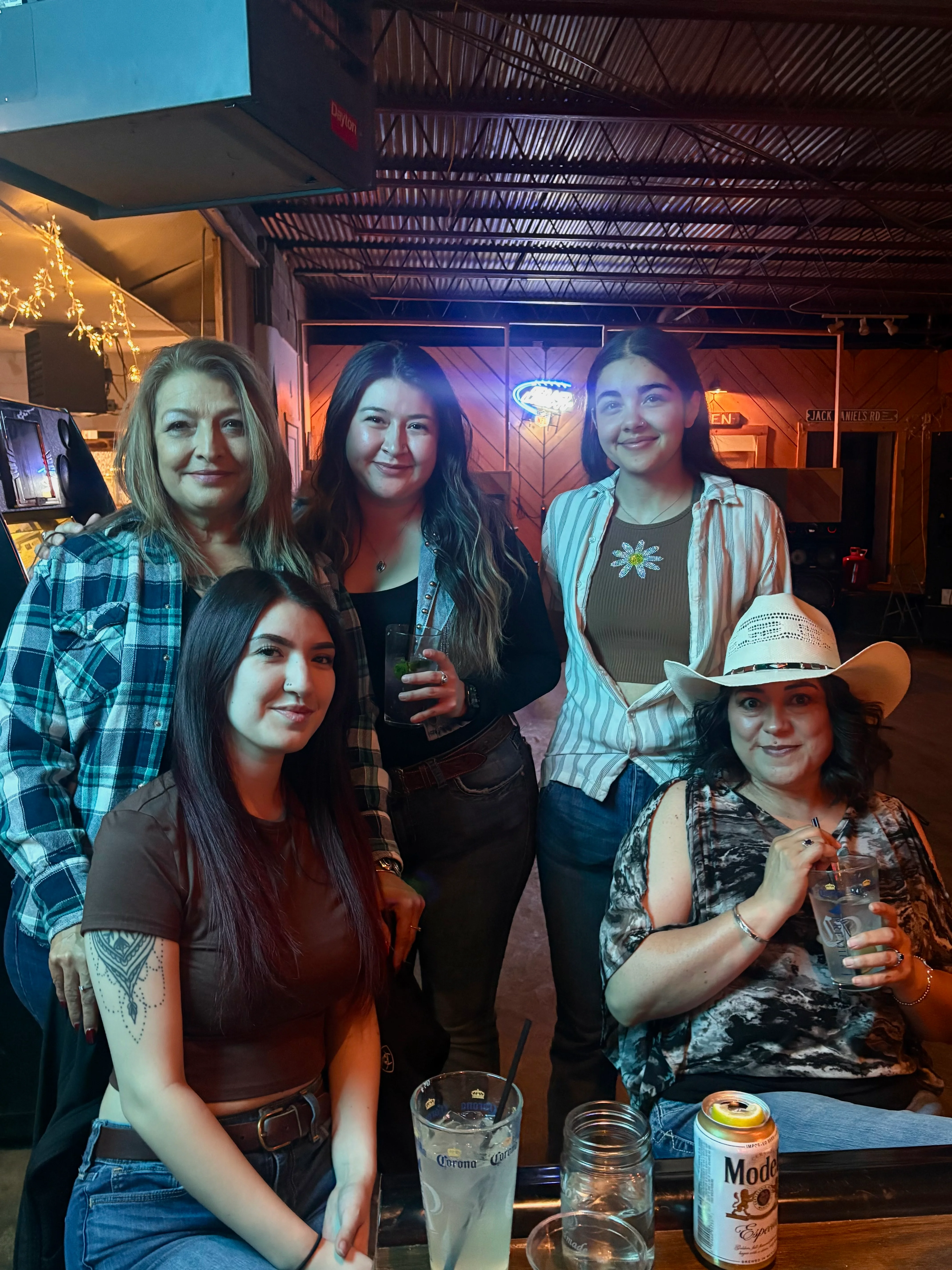 Group of friends enjoying drinks in a lively bar setting