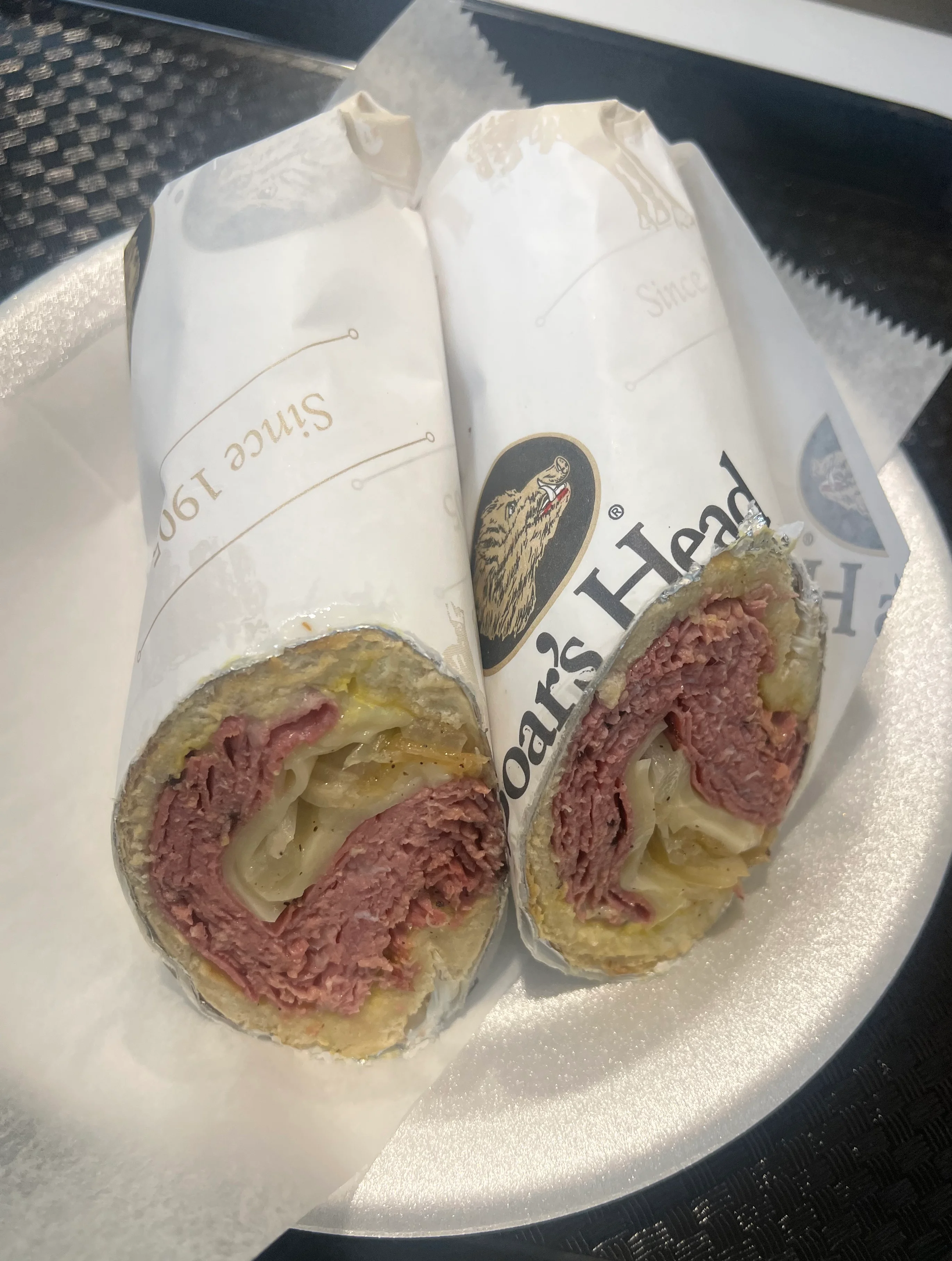 New York deli and grill logo featuring iconic Statue of Liberty design