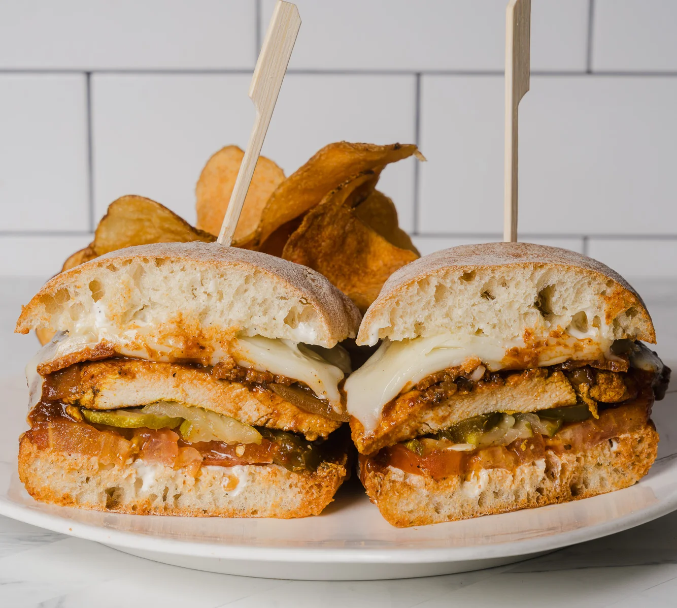 Chipotle Chicken sandwich at Wild Carvery in Burbank with grilled chicken, chipotle aioli, crispy onions, lettuce, tomato and melted cheese