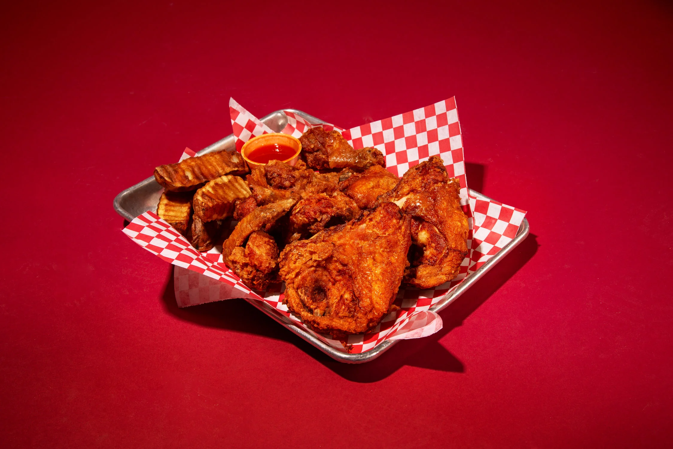 Crispy Southern fried chicken with seasoned potato wedges