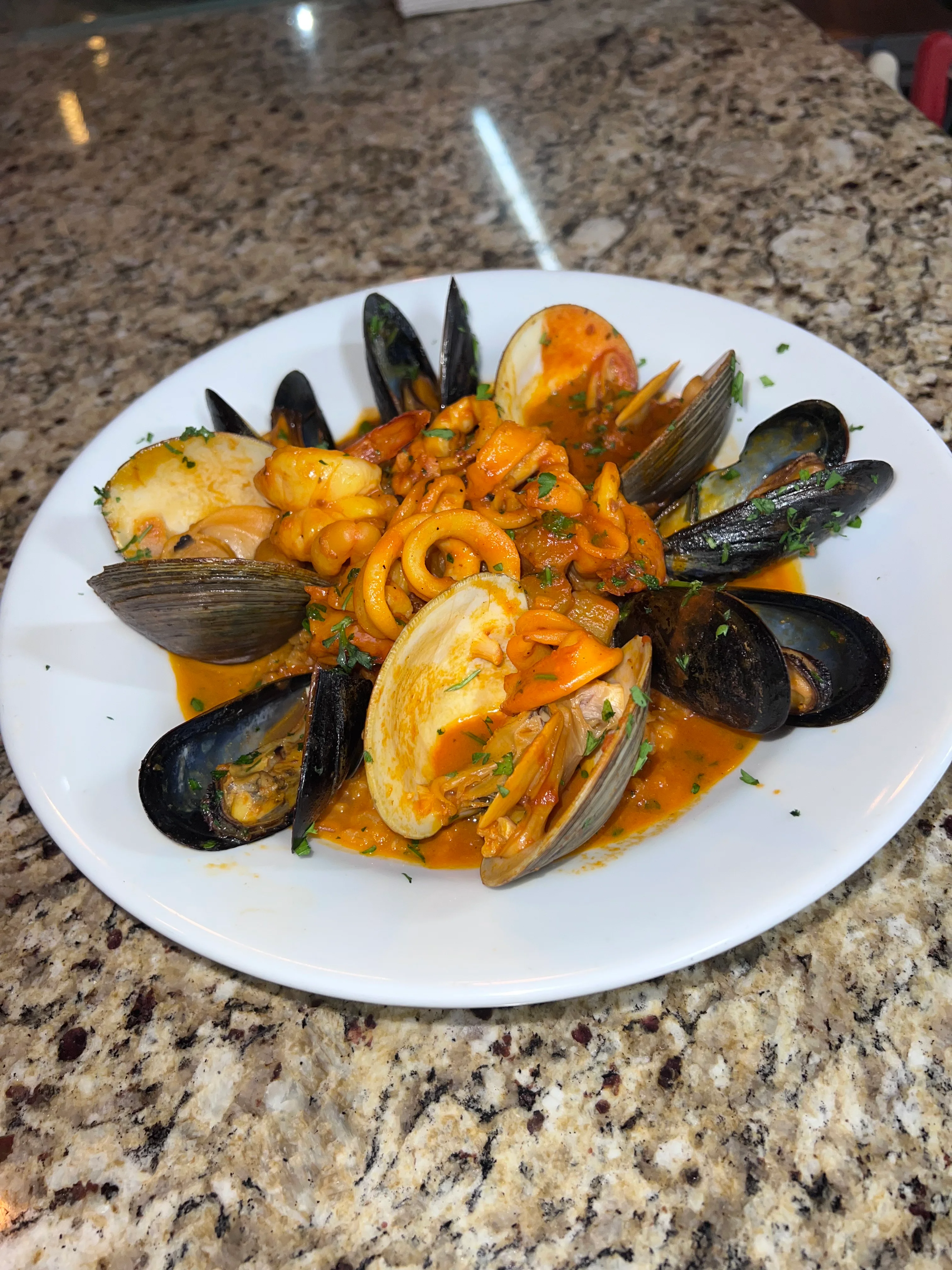 Italian seafood pasta with clams and mussels in a rich tomato sauce