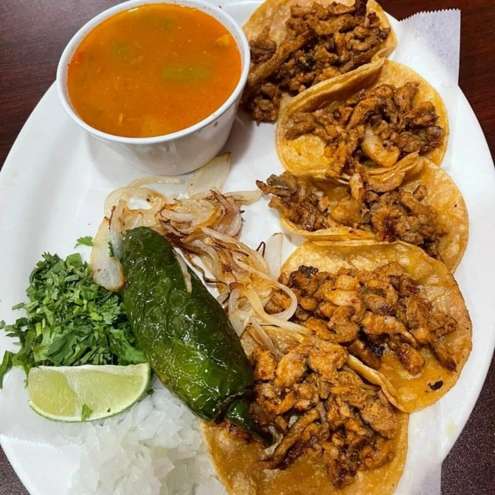 Authentic Mexican tacos al pastor with consommé