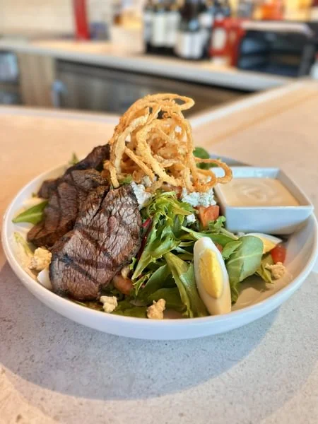 Grilled steak salad with crispy onions