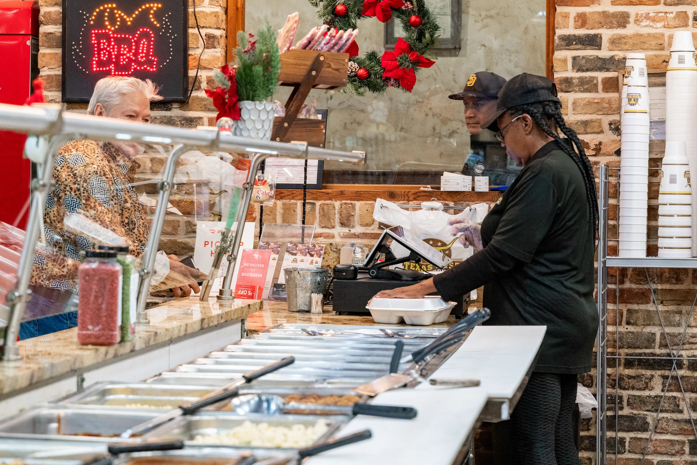 Texas Best Worker taking a customer order