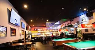 Cozy bar interior with pool table and vibrant lighting