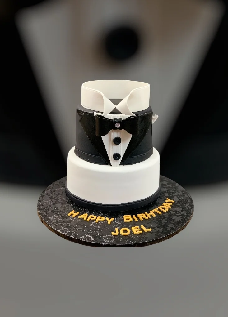 Elegant birthday cake designed as a tuxedo