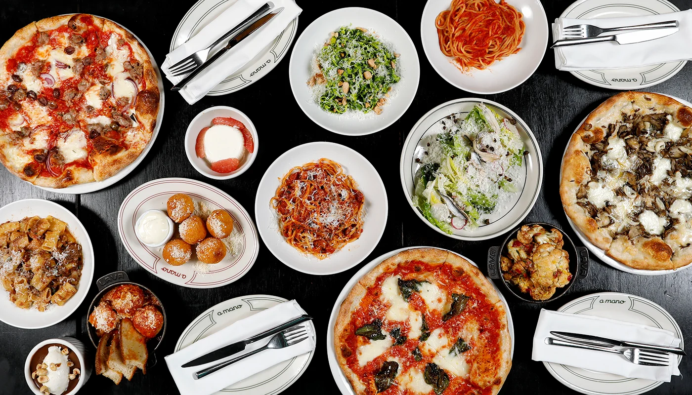 Italian feast featuring various pizzas and pasta dishes