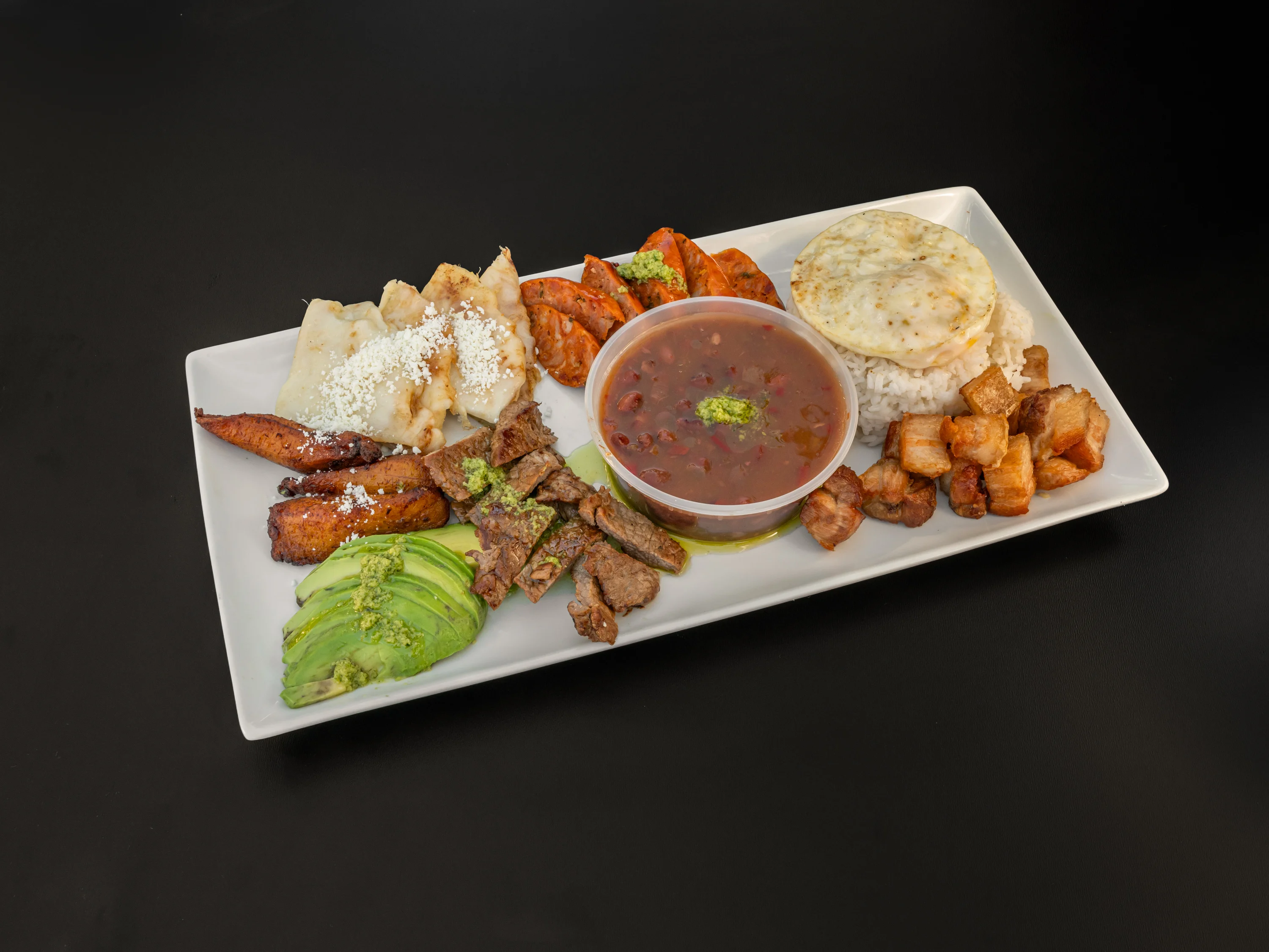 Traditional Honduran plato típico with rice and meats