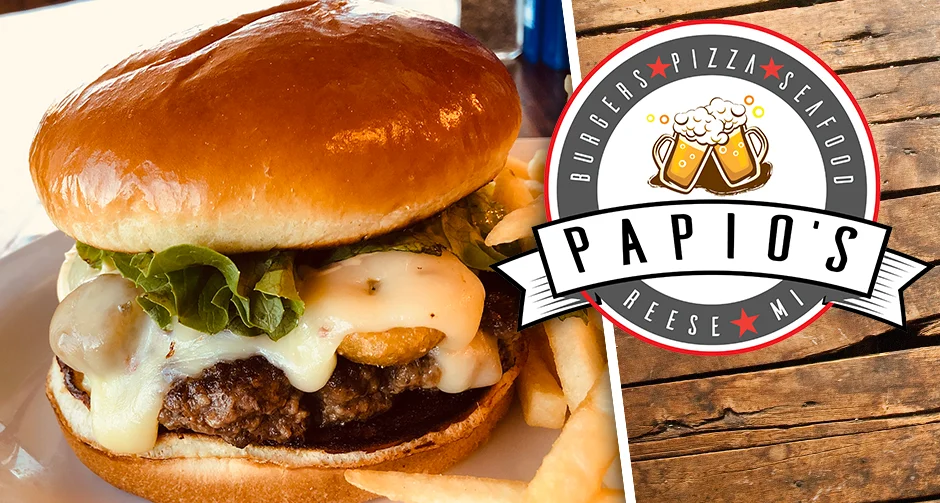 Juicy cheeseburger with lettuce in a rustic restaurant setting