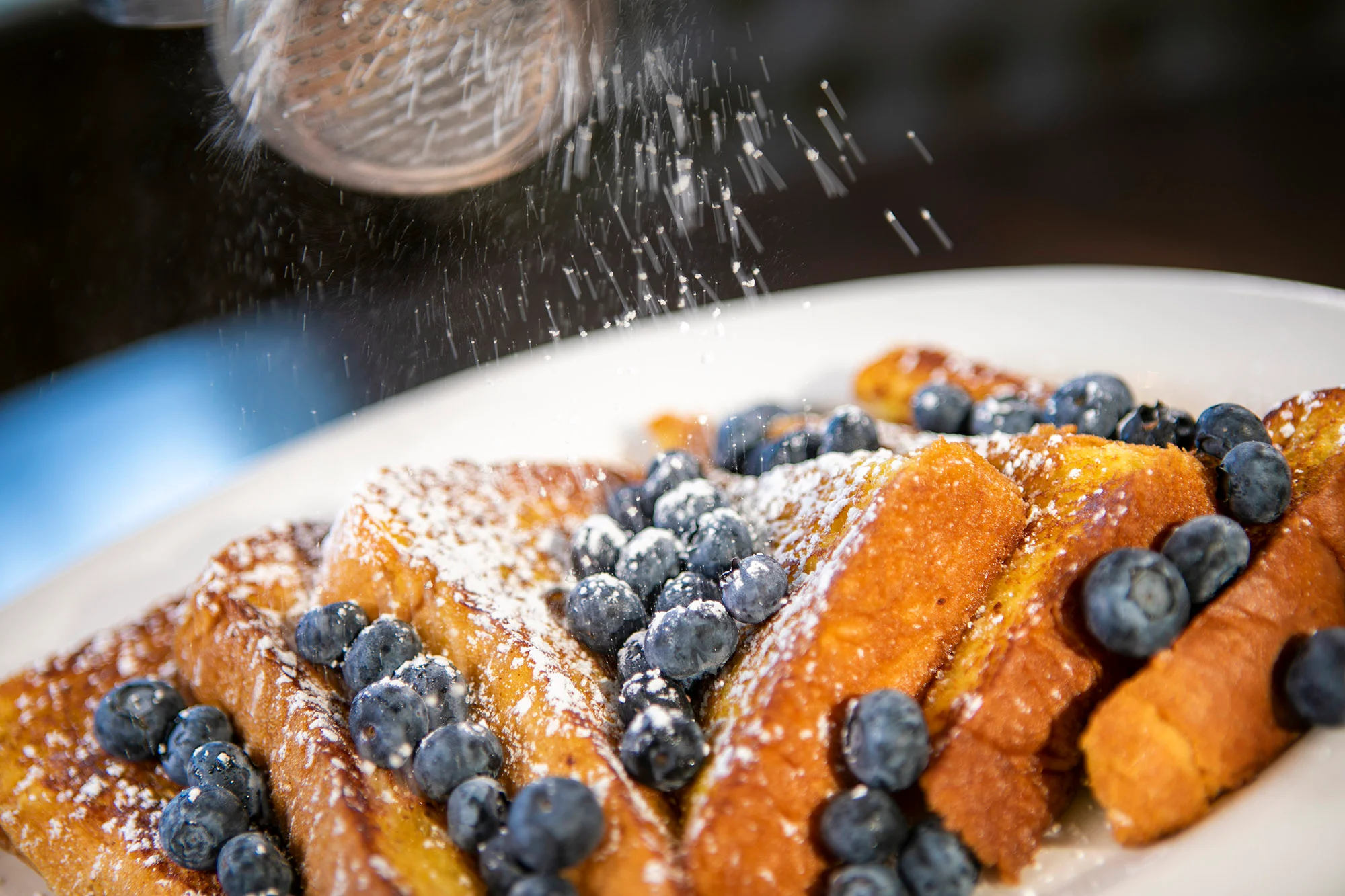 Delicious French toast topped with blueberries and powdered sugar