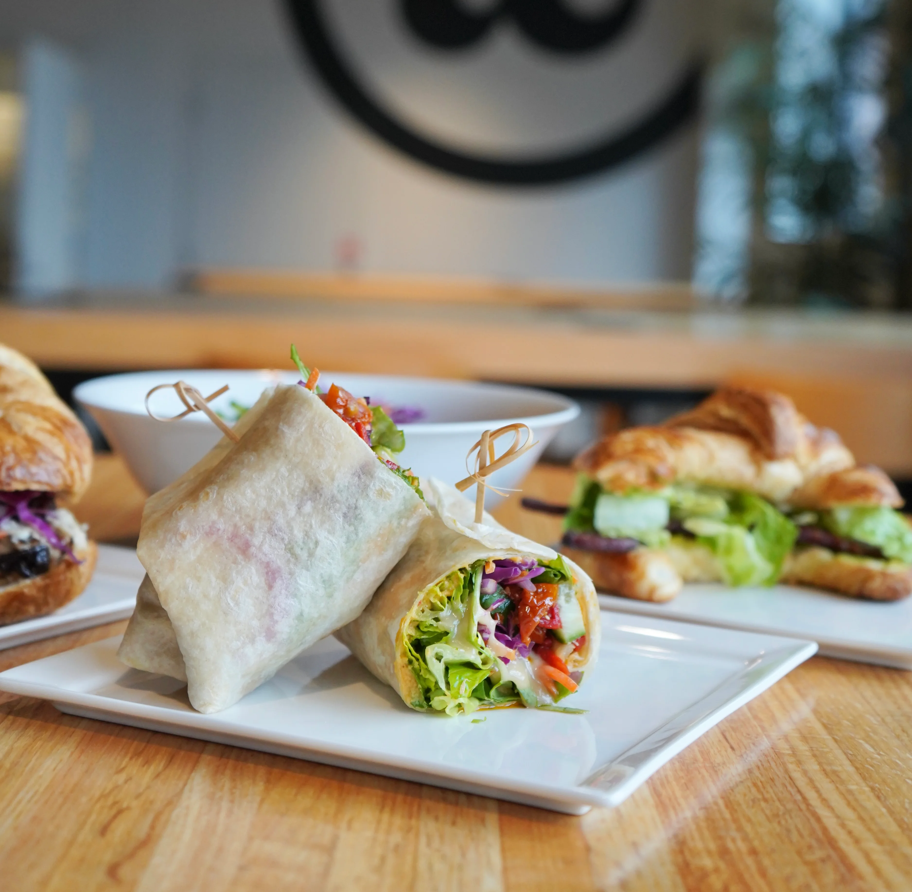 Delicious gourmet burger with fresh toppings on a wooden table