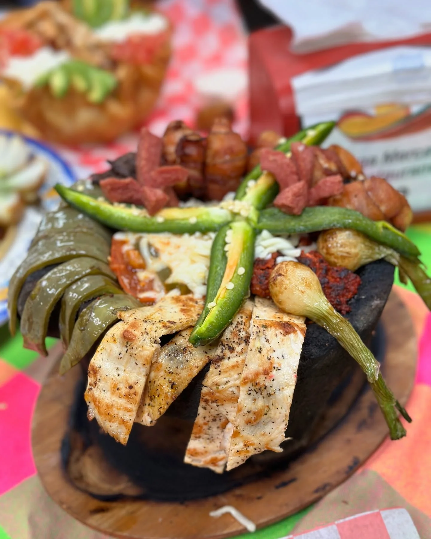 Mexican mixed grill platter with grilled meats and vegetables
