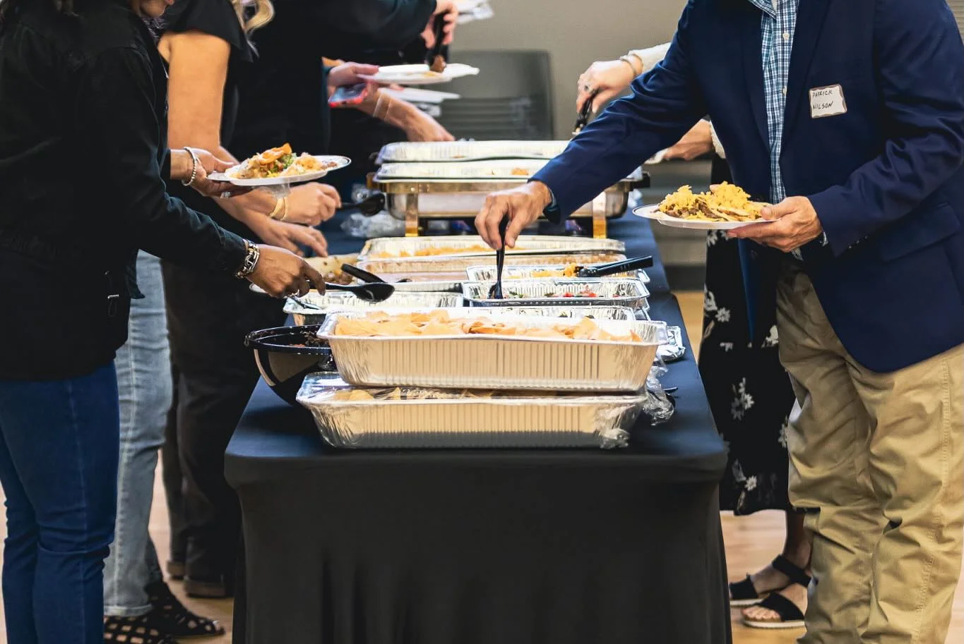 Buffet spread with diverse dishes at a catered event