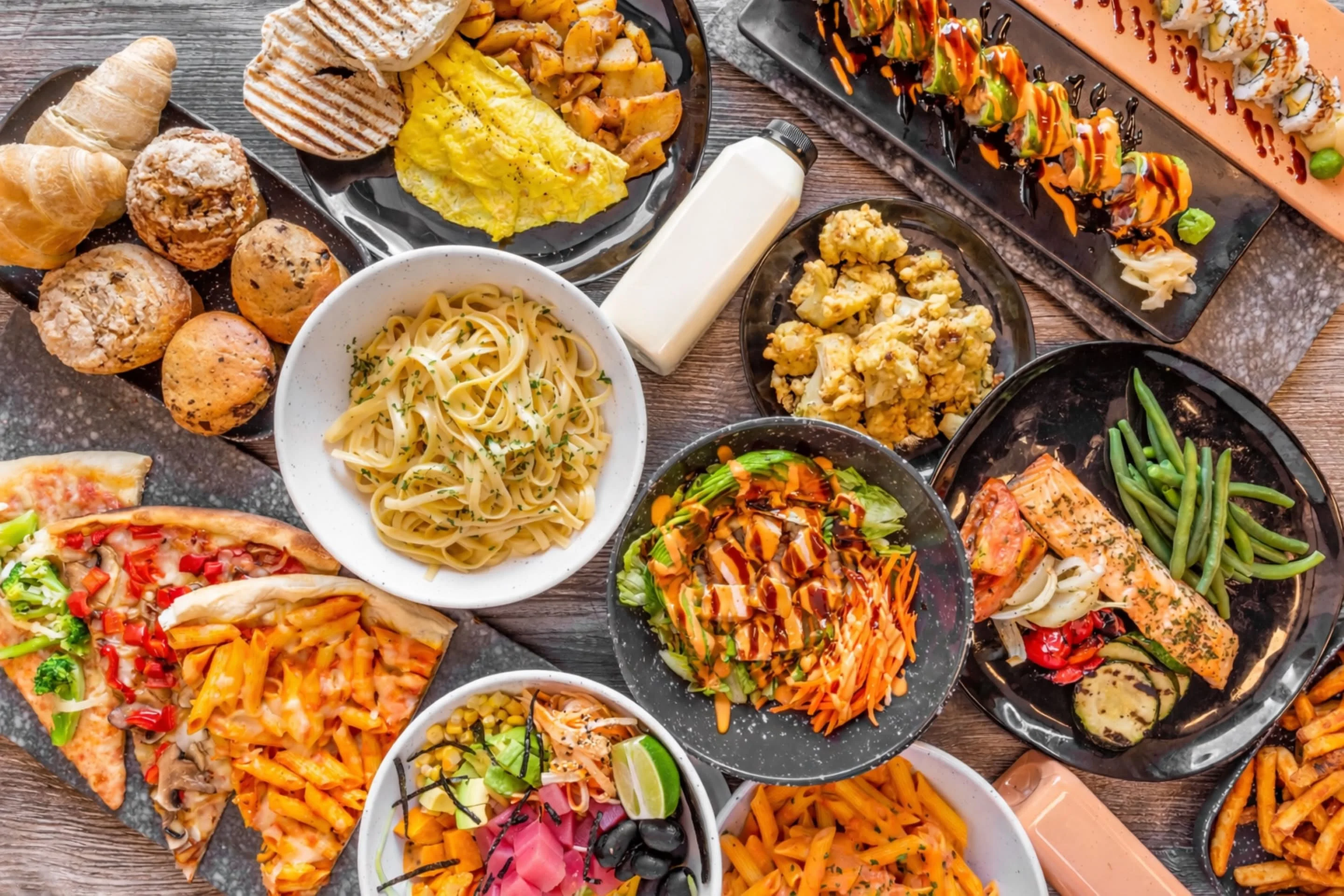 Assorted international dishes including sushi and pasta