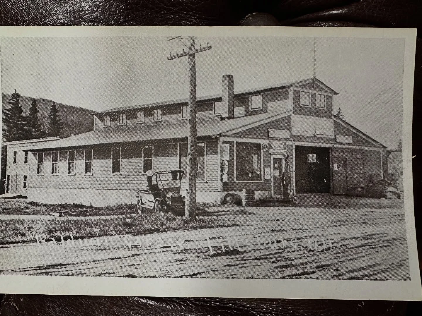 Historic restaurant building with vintage cars