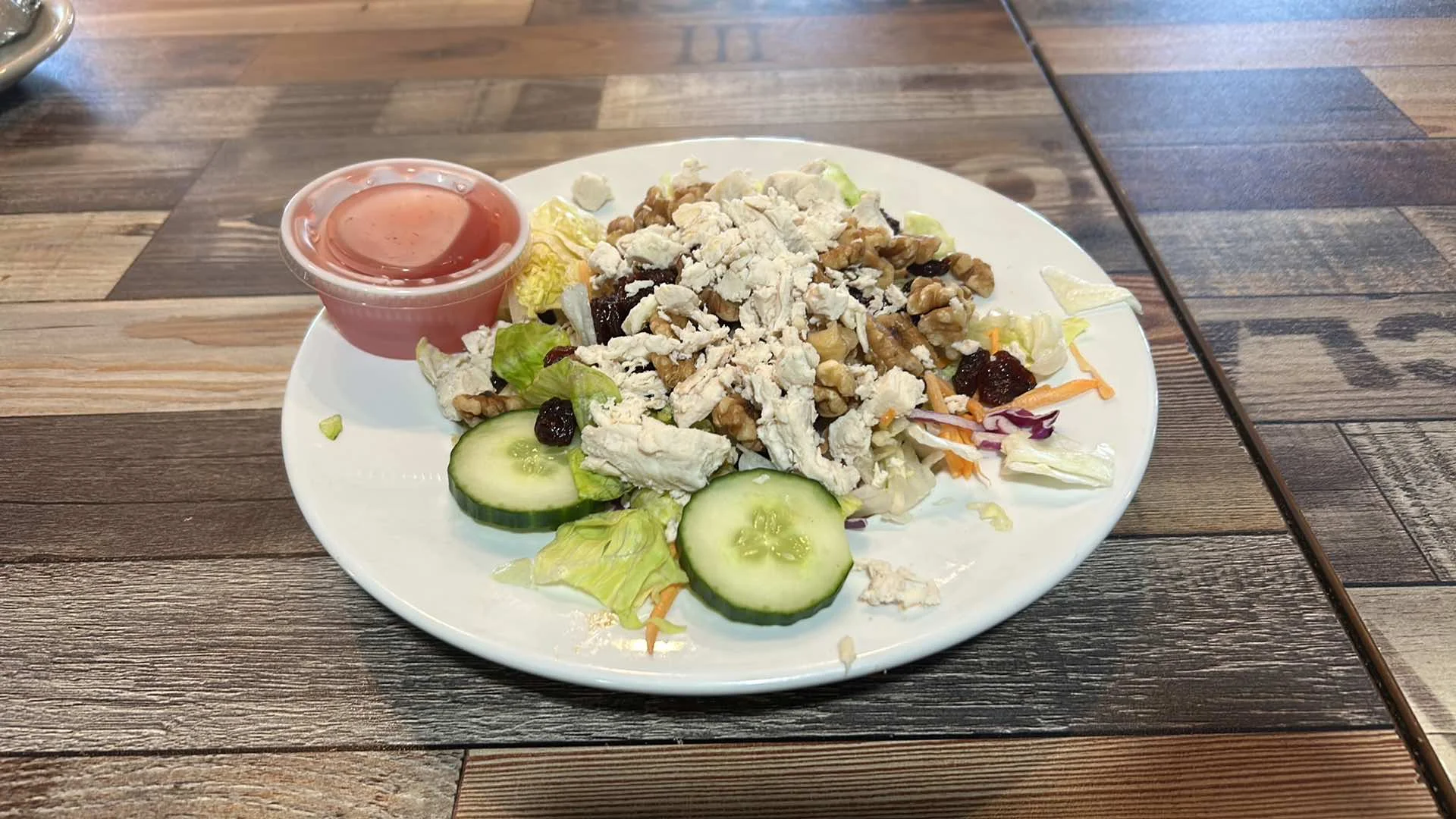 Chicken walnut salad with fresh greens and dressing