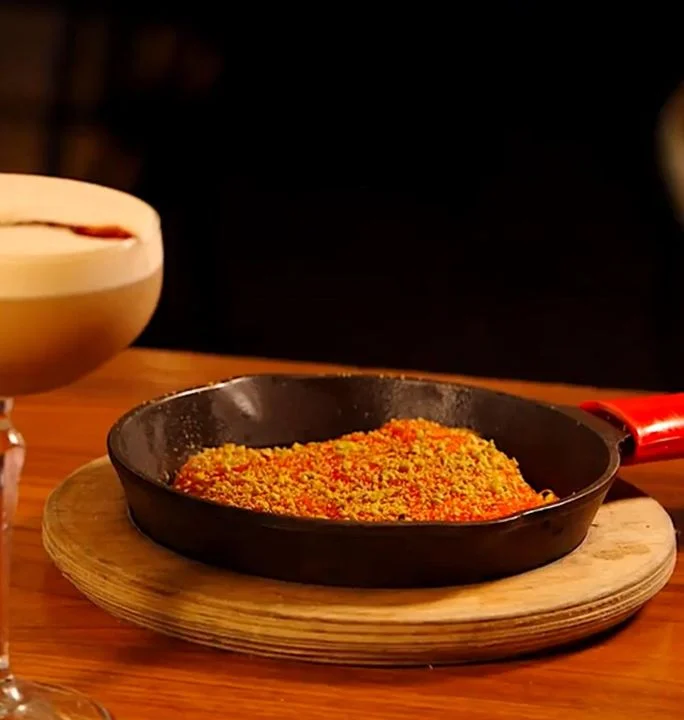 Seasoned rice dish served in a cast-iron skillet