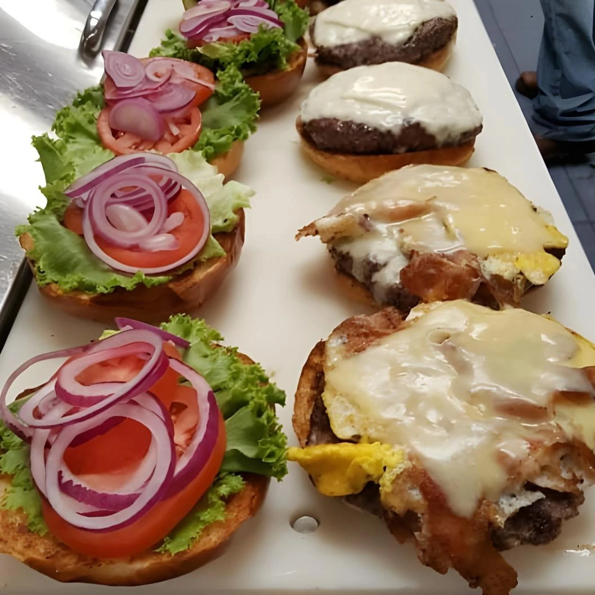 Delicious cheeseburgers with fresh toppings ready to serve