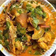 Nigerian egusi soup with leafy greens and fish