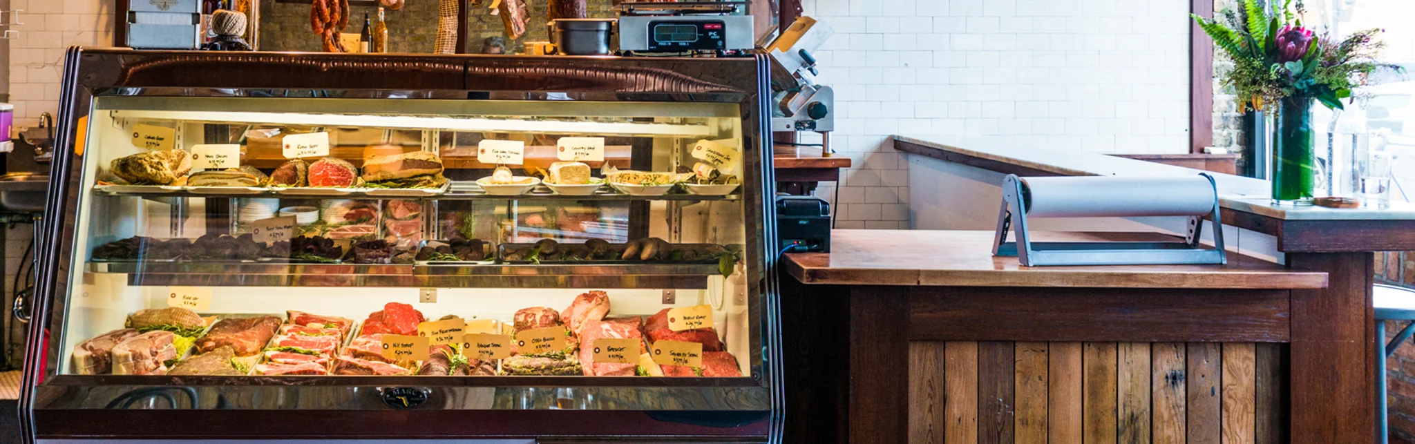 Butcher shop display with assorted meats and charcuterie