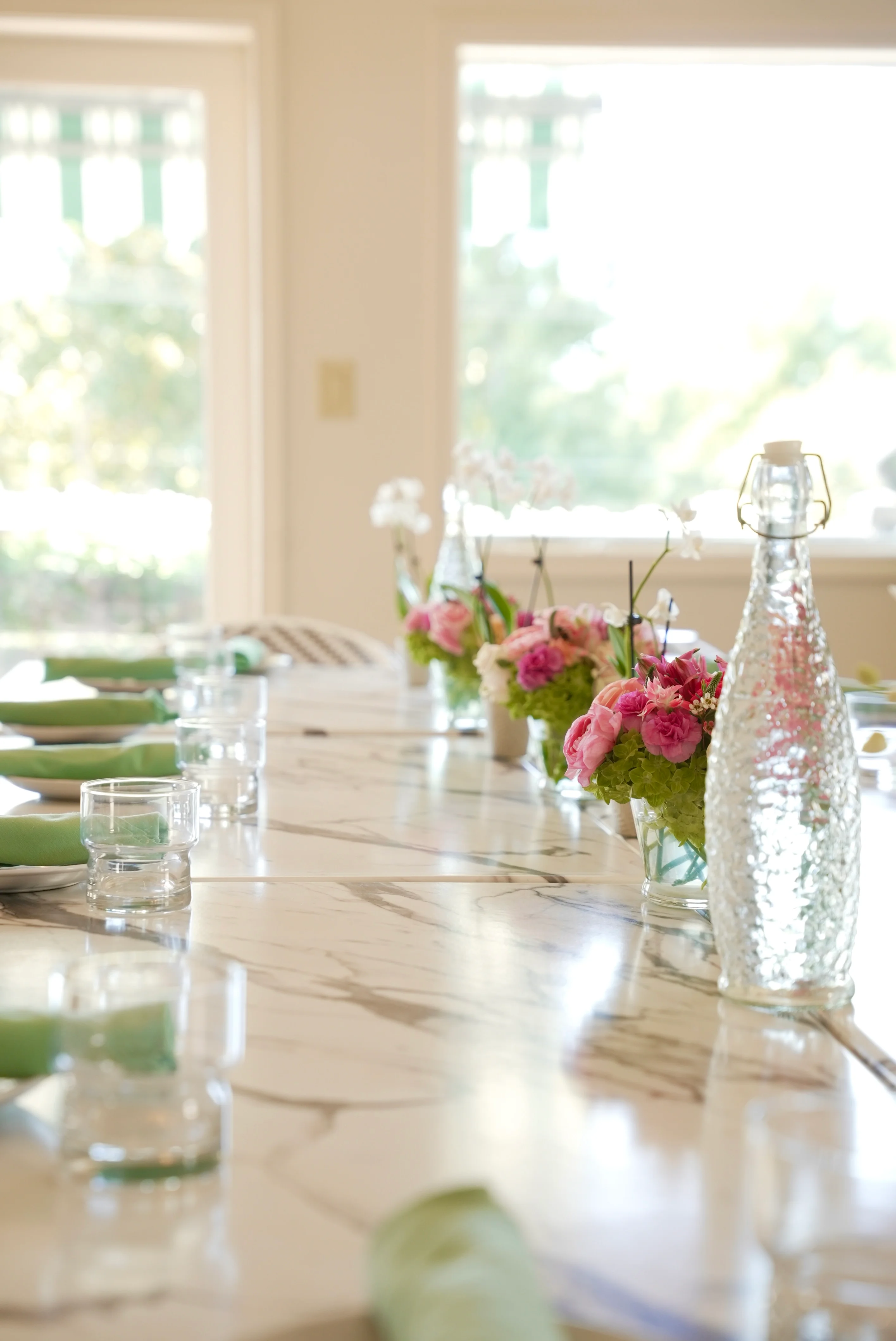 Elegant dining table set with flowers and glassware