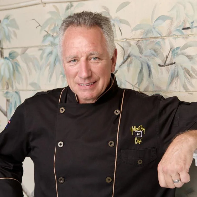 Chef in a black uniform at a restaurant