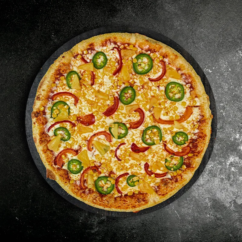 Hawaiian pizza topped with jalapeños and pineapple