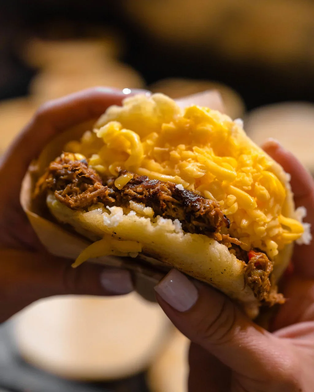 Arepa filled with shredded beef and cheese