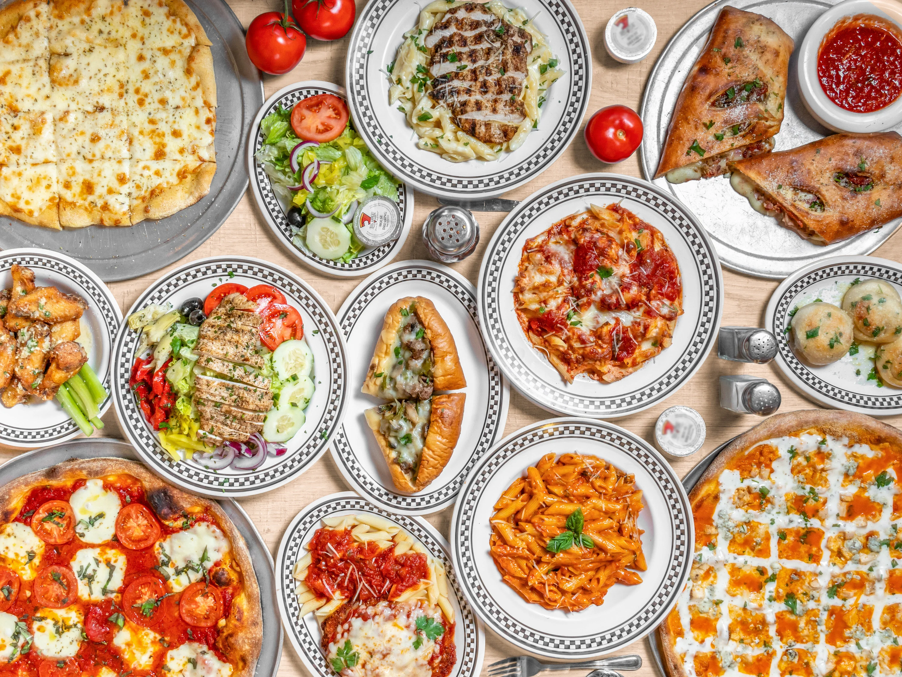 Assorted Italian dishes including pizza and pasta