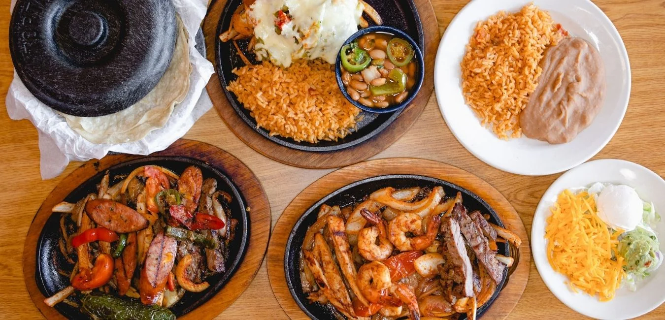 Sizzling fajitas platter with shrimp and steak