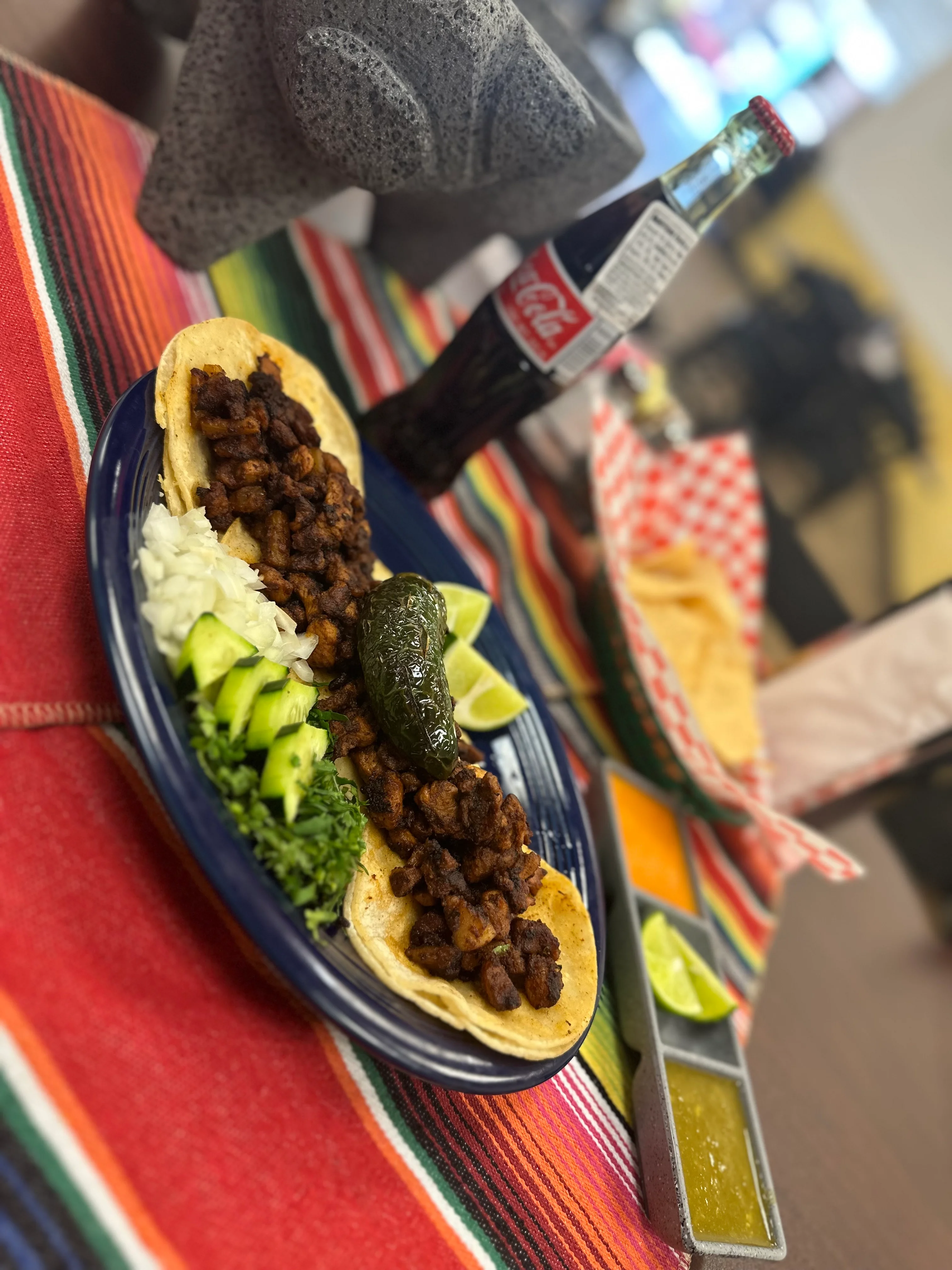 Authentic Mexican tacos al pastor with fresh toppings