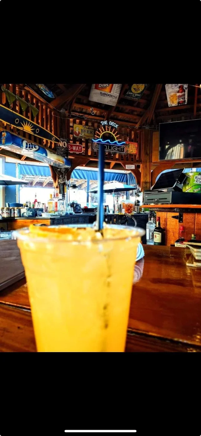 Refreshing cocktail at a vibrant bar with rustic decor