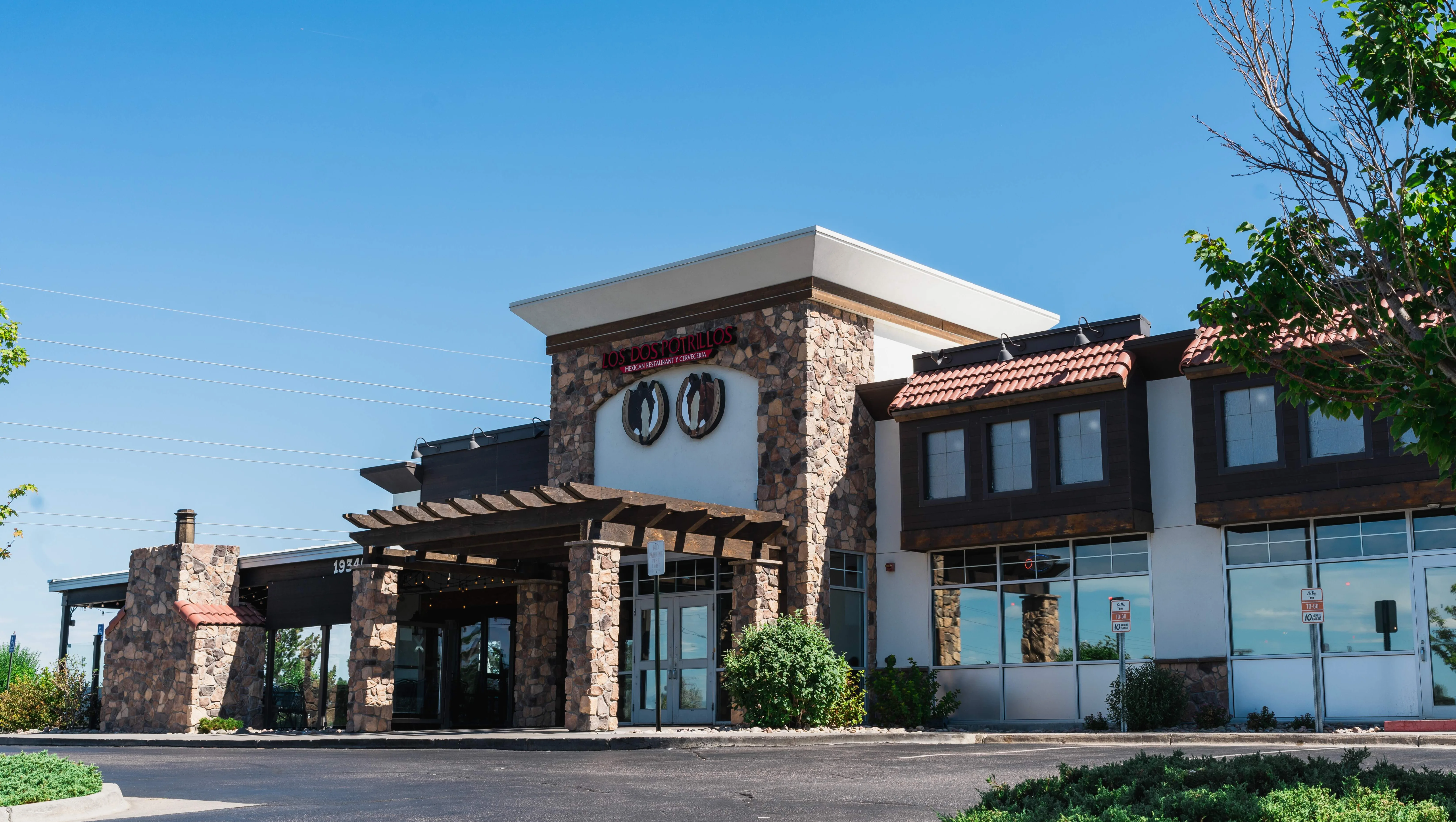 Exterior view of a modern Mexican restaurant with stone accents