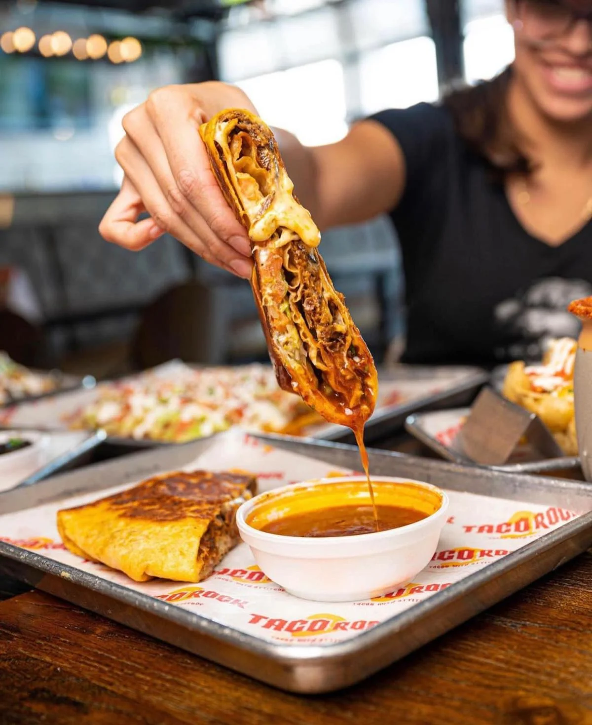 Cheesy beef burrito with dipping sauce