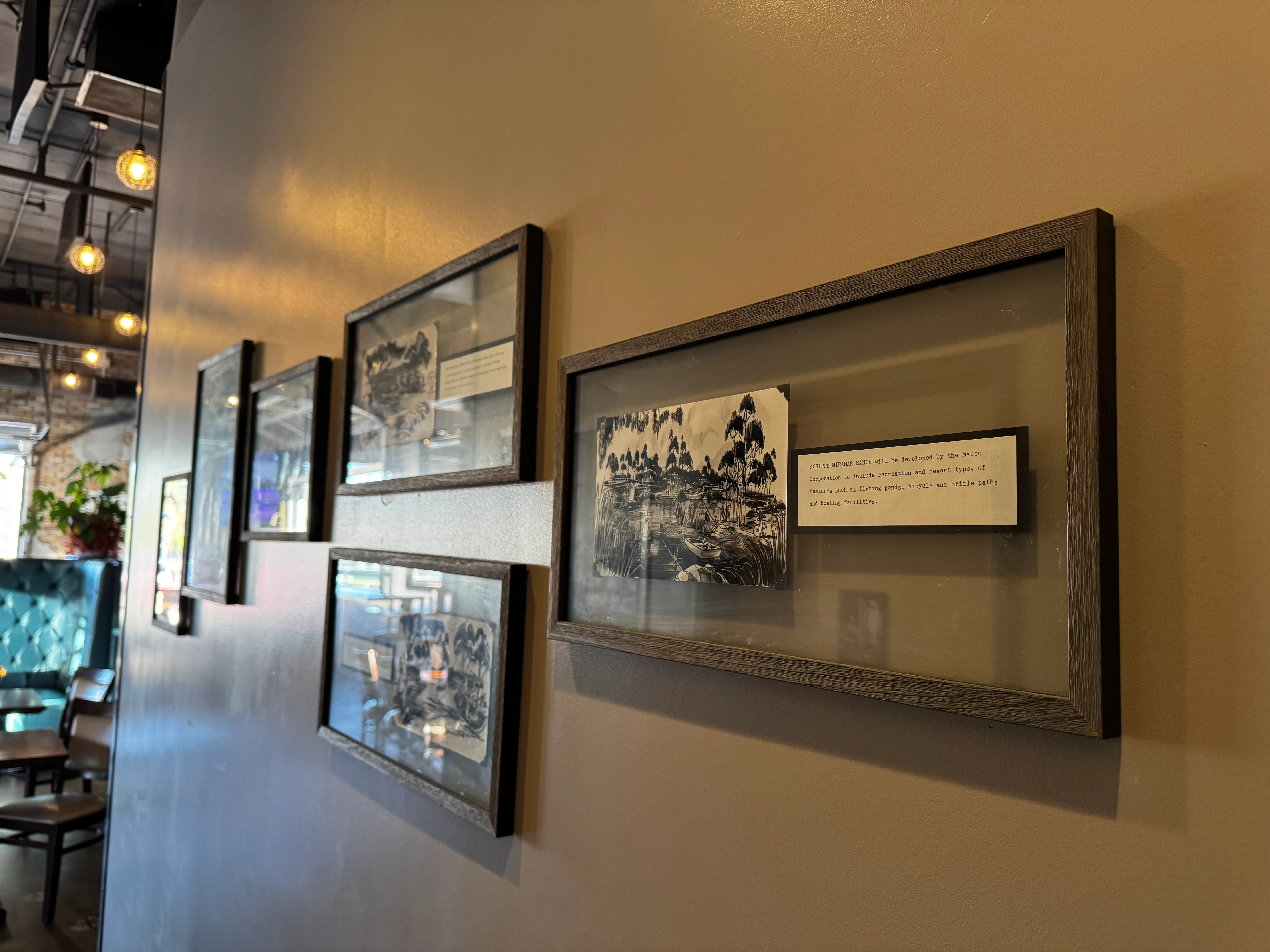 Artistic restaurant wall decor with framed historical images