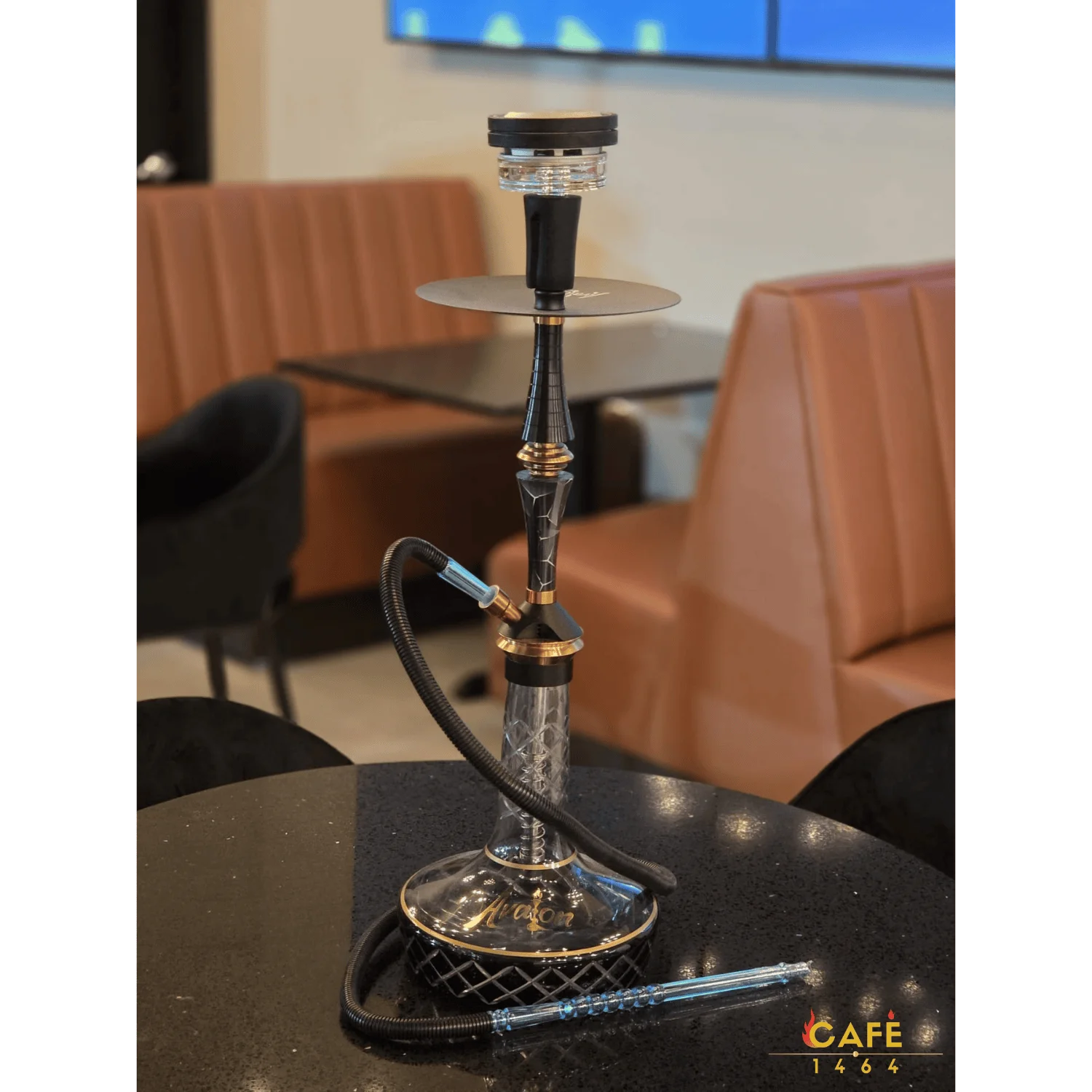 Elegant hookah on a black table in a modern café setting