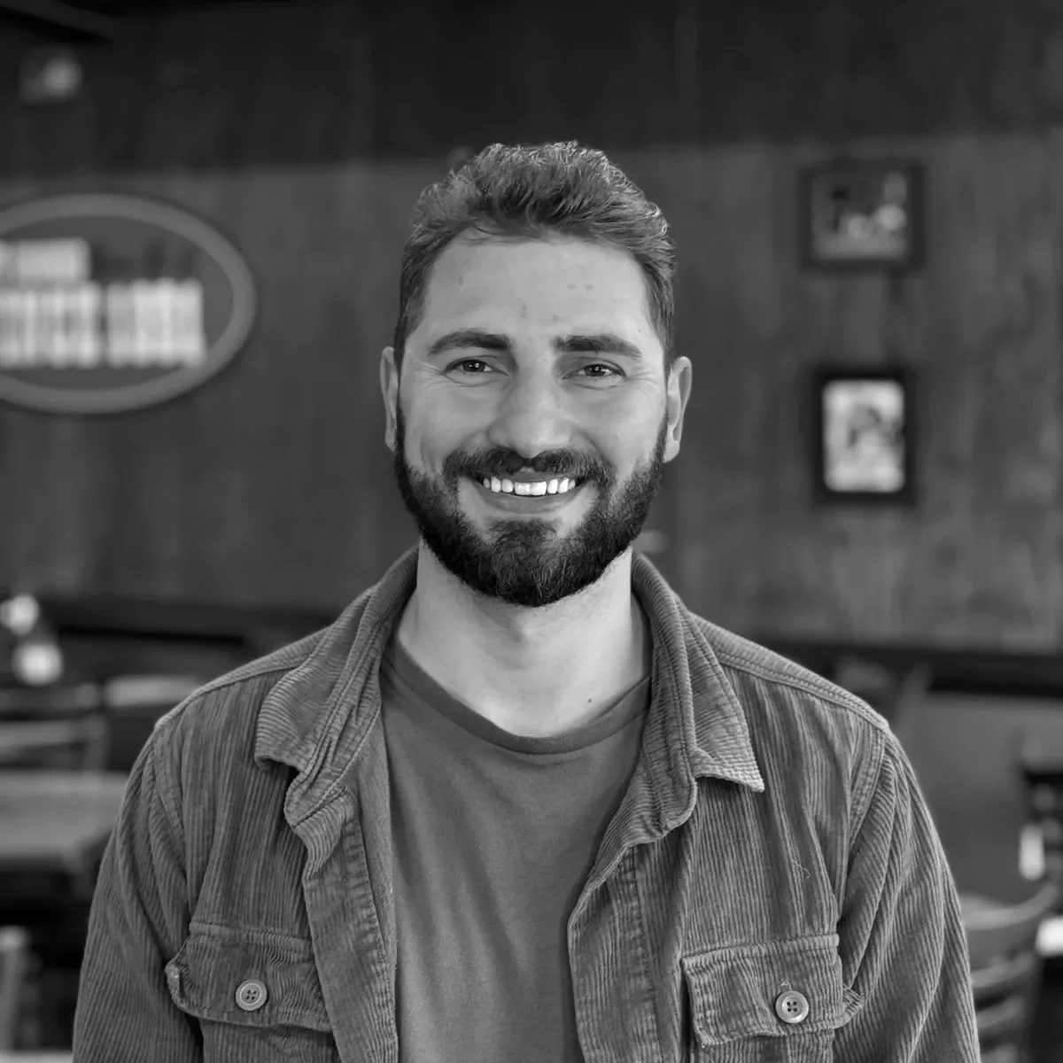 Smiling man in a cozy restaurant setting