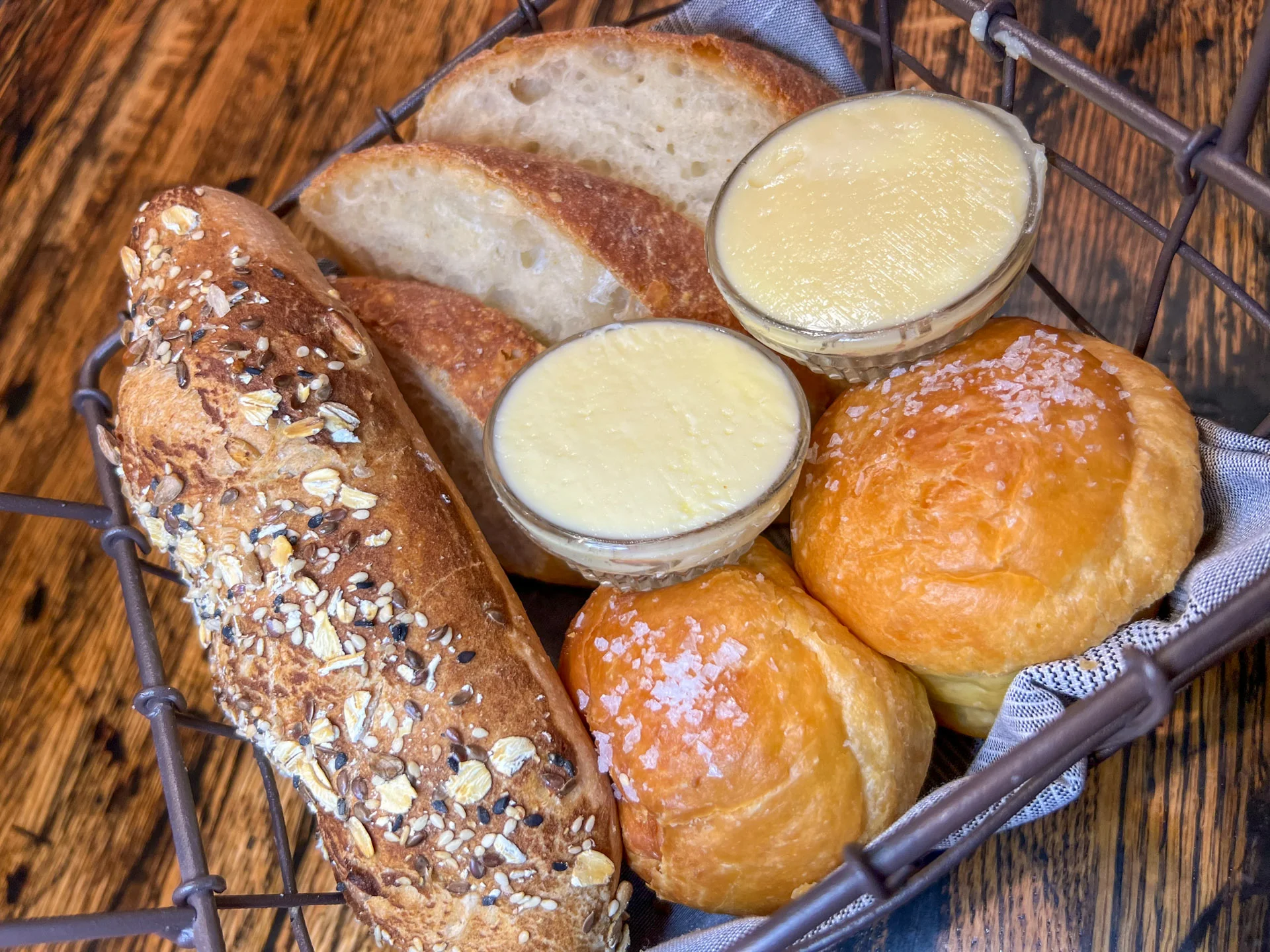 Handmade Breads herbed gougere, seed bread, biscuits, artisan butters