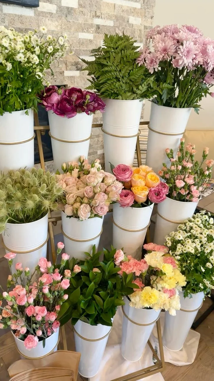 Colorful flower arrangement in white pots