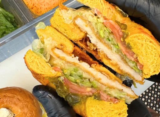 Vibrant chicken sandwich with colorful bread and fresh toppings