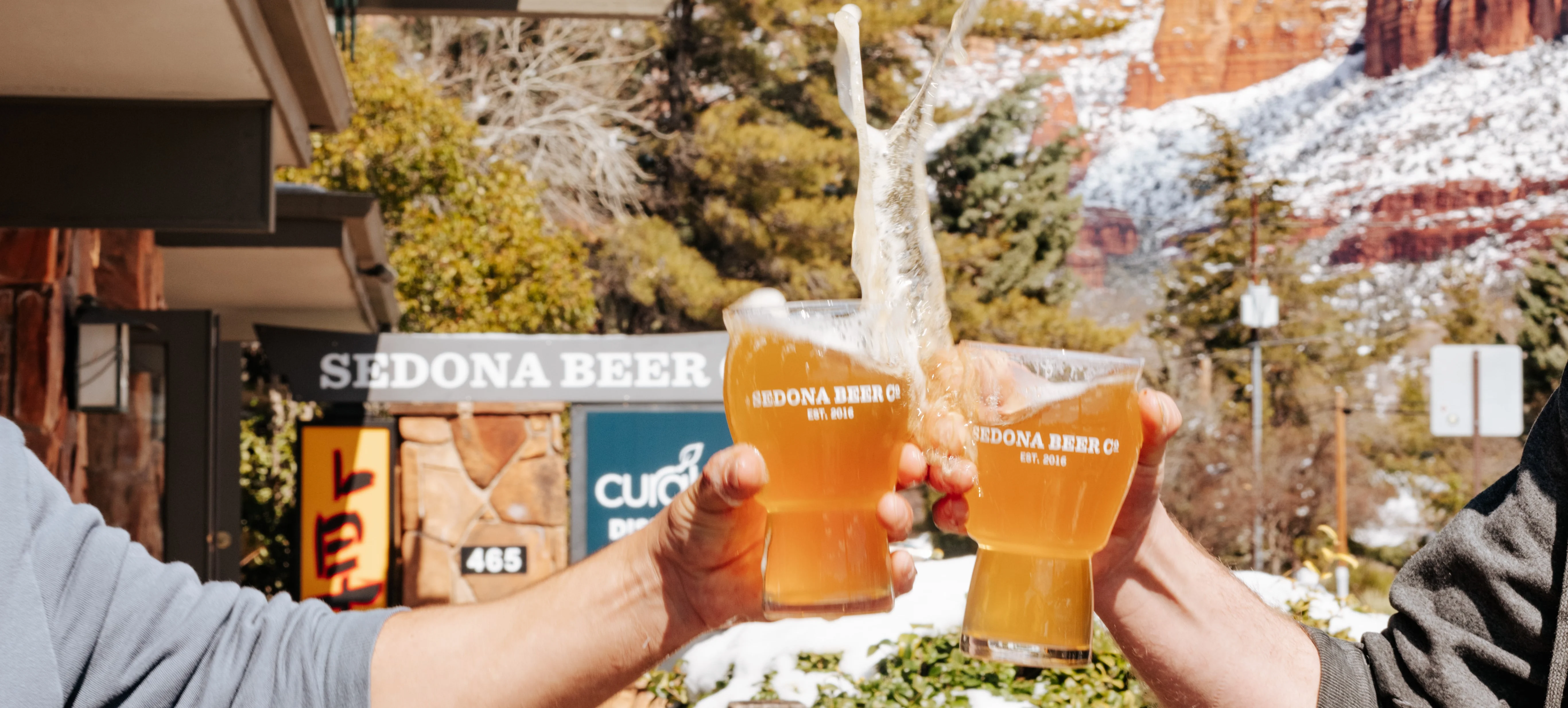 Cheers with craft beers in Sedona's scenic outdoor setting