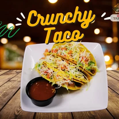 Crunchy tacos served with salsa in a vibrant restaurant setting