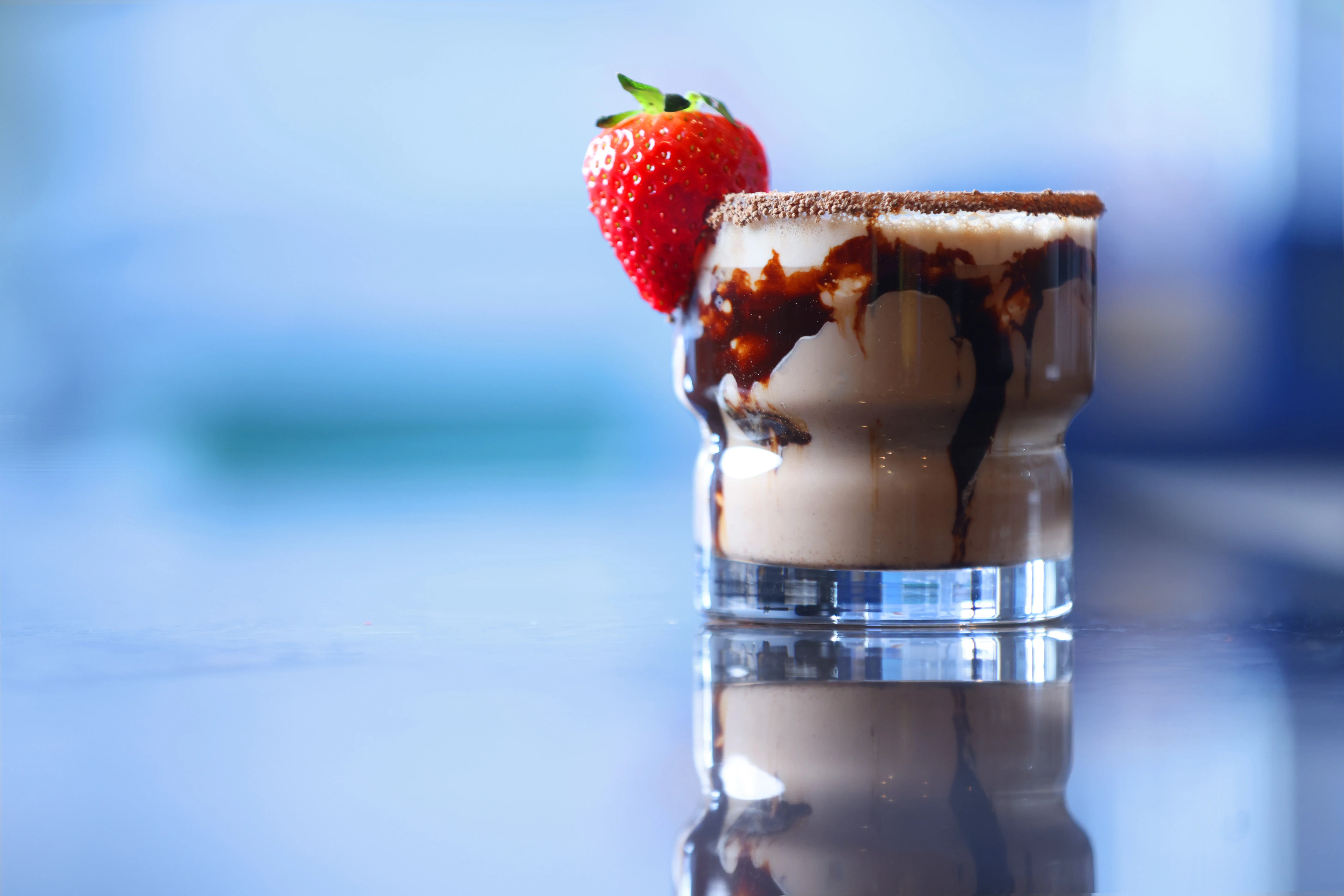 Decadent chocolate milkshake with strawberry garnish