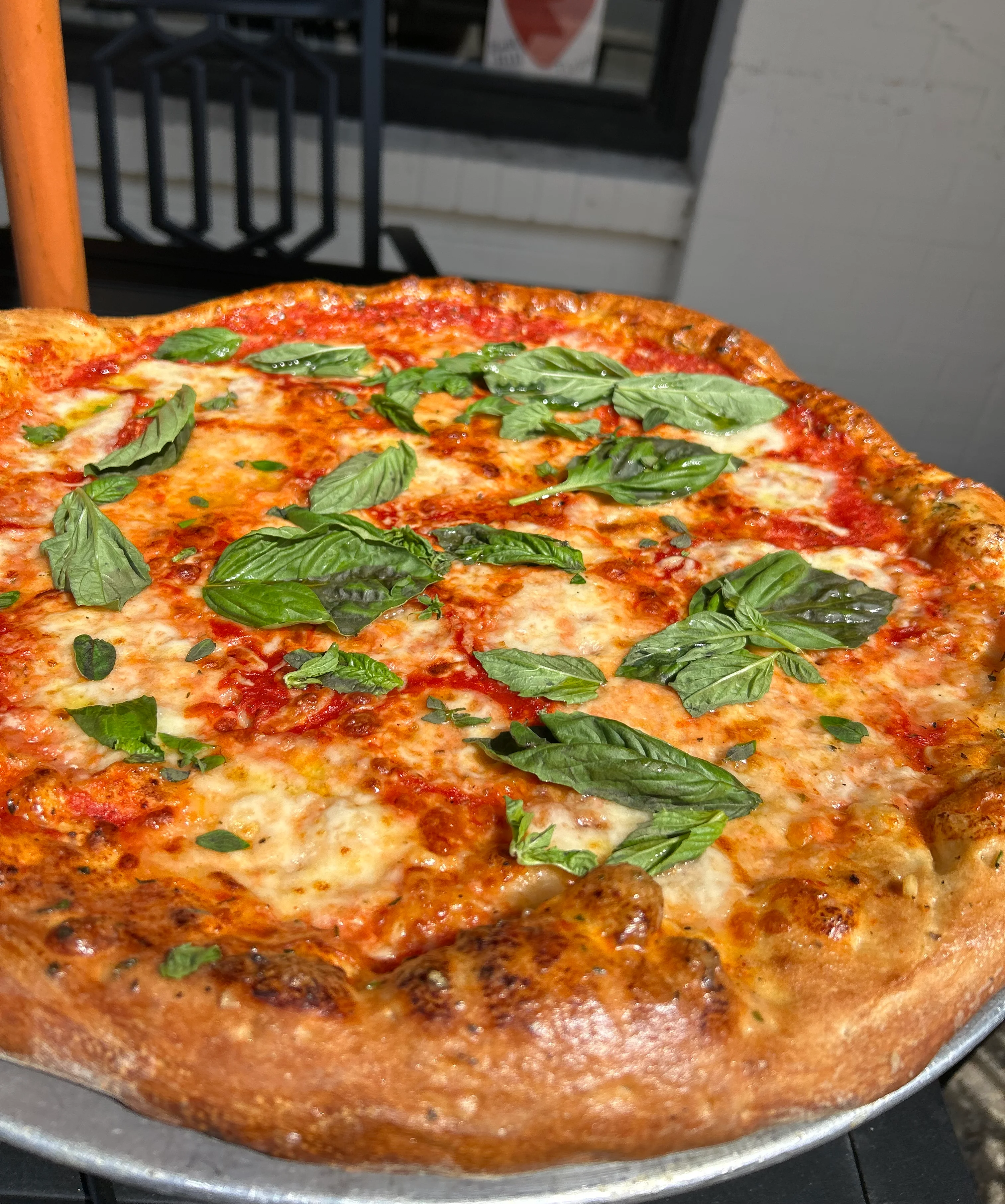 Delicious pizza with fresh toppings at East Hill Pizza restaurant
