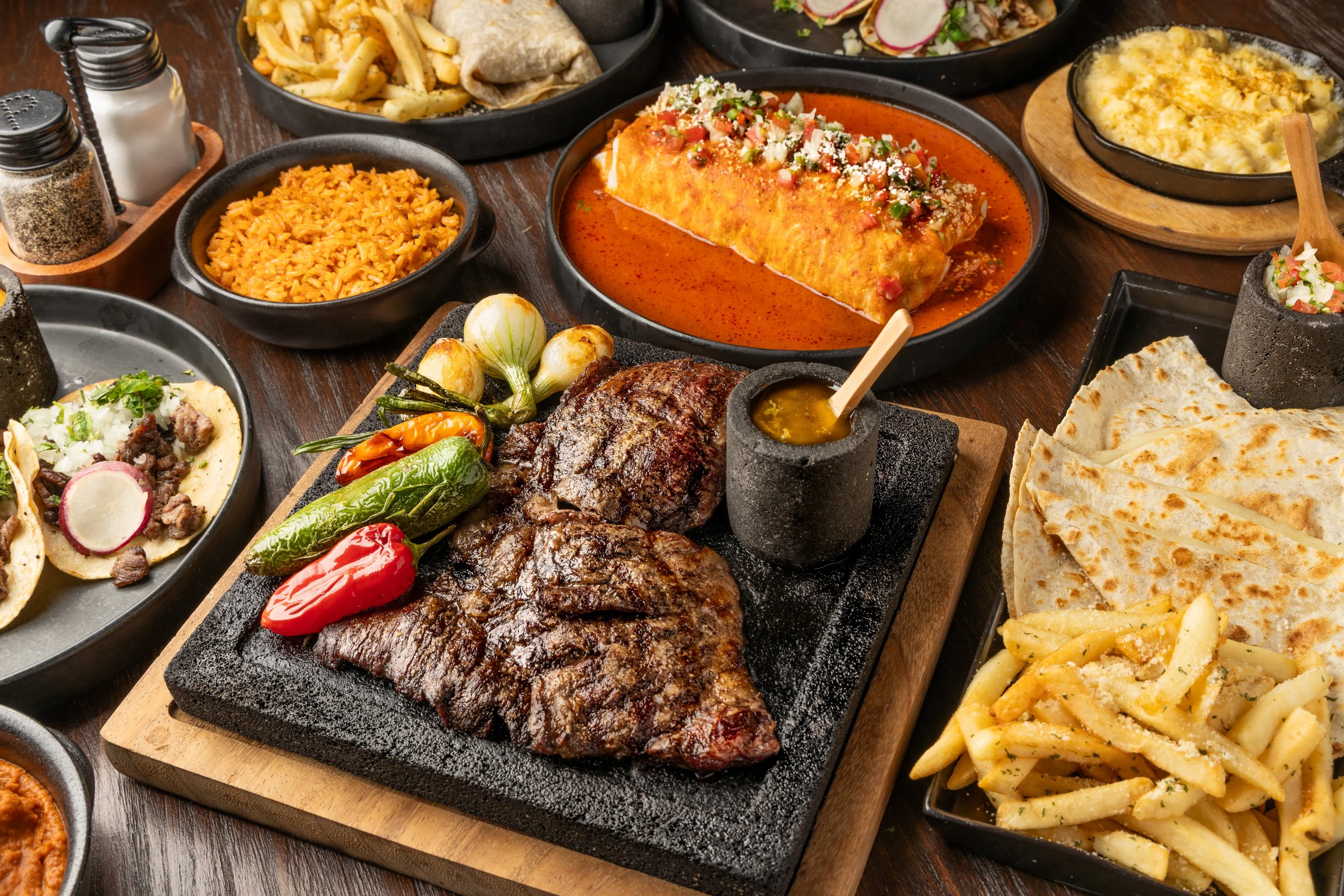 Sizzling fajitas served on a hot stone platter